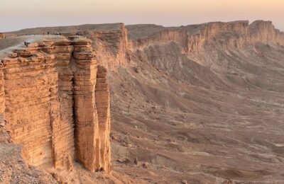 brown rock formation under white sky during daytime