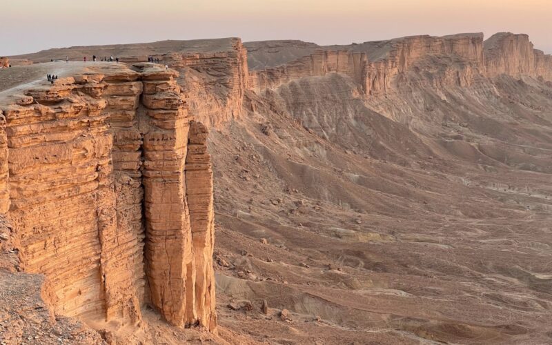 brown rock formation under white sky during daytime